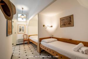 Postel nebo postele na pokoji v ubytování San Giorgio by PortofinoVip