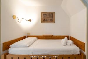 Postel nebo postele na pokoji v ubytování San Giorgio by PortofinoVip