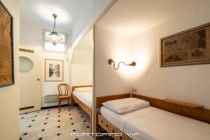 Postel nebo postele na pokoji v ubytování San Giorgio by PortofinoVip
