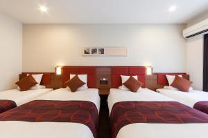 Postel nebo postele na pokoji v ubytování HOTEL MYSTAYS Haneda