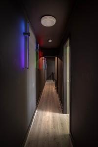 a long hallway with a purple light on the wall at Town View Apartment by Sasco in Blackpool