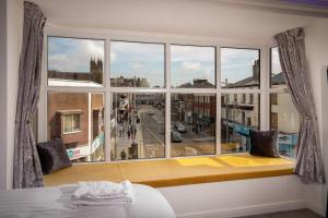 a window seat with a view of a city street at Town View Apartment by Sasco in Blackpool