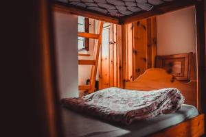 Кровать или кровати в номере Rifugio Baita Fos-Ce