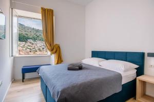 Posteľ alebo postele v izbe v ubytovaní ART DECO DUBROVNIK ROOMS by DuHomes