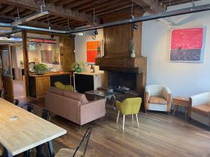 a living room with a couch and a fireplace at Hotel Salvators in Bruges