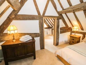 Postel nebo postele na pokoji v ubytování Manor Cottage