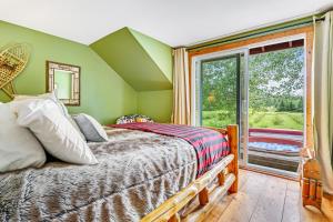 a bedroom with a bed and a window at Roxbury Retreat in Roxbury
