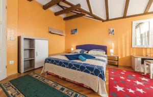 a bedroom with a large bed in a room at Holiday home Sunny Dalmatia in Mratovo