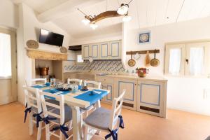 A kitchen or kitchenette at Trullo Mmammineddhu by Salento Affitti