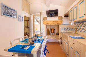 A kitchen or kitchenette at Trullo Mmammineddhu by Salento Affitti
