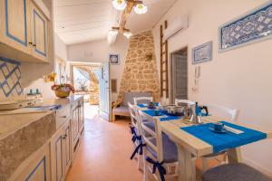 A kitchen or kitchenette at Trullo Mmammineddhu by Salento Affitti