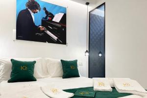 Postel nebo postele na pokoji v ubytování Kreart Suite & Rooms B&B