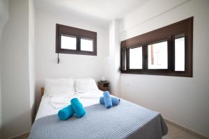 Posteľ alebo postele v izbe v ubytovaní Armonia House 1 bedroom 3 guests bath tub & patio