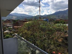 a view of a city from the balcony of a house at Apartamento Lof , Dúplex , iluminado ,bueno , céntrico y bien ubicado in Medellín