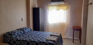 Ένα ή περισσότερα κρεβάτια σε δωμάτιο στο House