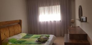 Katil atau katil-katil dalam bilik di Apartment Haut standing Panamera Residence Khezema Sousse