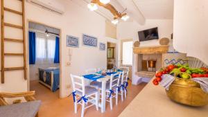A kitchen or kitchenette at Trullo Mmammineddhu by Salento Affitti