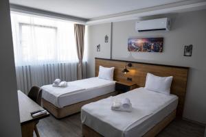 Krevet ili kreveti u jedinici u okviru objekta Comfort Center Suit Hotel