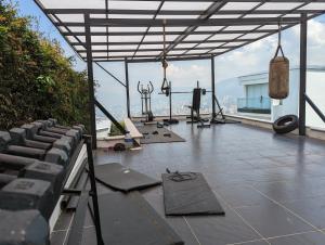 a gym on top of a building with a view at Nomad Finca in Envigado