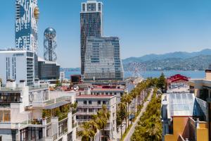 a view of a city with tall buildings at Tapis Rouge Design Boutique Hotel in Batumi