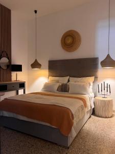 a bedroom with a large bed and two lamps at Apartament BellaPola Trapani in Trapani