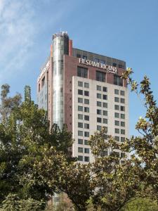 a tall building with a sign on it at Grand Fiesta Americana Chapultepec in Mexico City