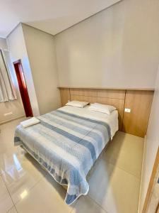 Un pat sau paturi într-o cameră la Hotel Armenia