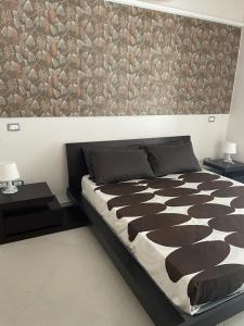 Postel nebo postele na pokoji v ubytování Residence PEGA B&B