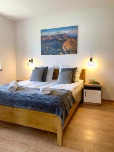 Postel nebo postele na pokoji v ubytování Gąsienicowy Widok