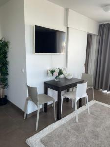 TV a/nebo společenská místnost v ubytování Bayer's Boardinghouse und Hotel