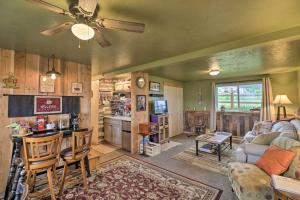 a living room with a couch and a table at Flathead Lake-View Studio 38 Mi to Blacktail in Big Arm