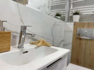 Kúpeľňa v ubytovaní Olivkowe apartamenty
