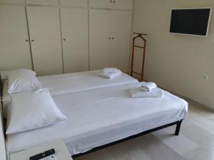 Postel nebo postele na pokoji v ubytování Iris Sunset Suite
