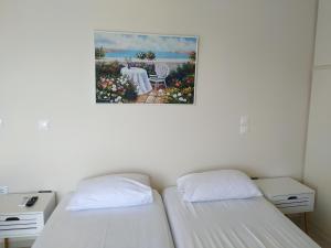 Postel nebo postele na pokoji v ubytování Iris Sunset Suite