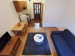 Televízia a/alebo spoločenská miestnosť v ubytovaní Uncle Apartment