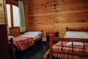 Cama ou camas em um quarto em Cabañas y Hostal Las Marias