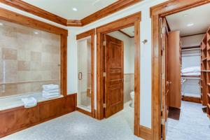a bathroom with a tub and a walk in shower at 1-#42 4BD One Willow Bridge Road in Vail