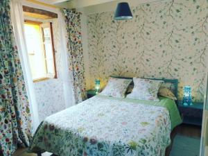 A bed or beds in a room at La Milana, Orbaneja del Castillo