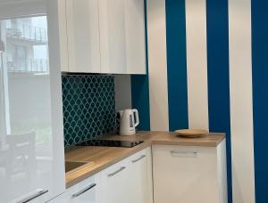 Kuchyňa alebo kuchynka v ubytovaní Olivkowe apartamenty