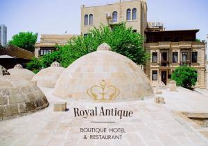 a group of domes with a building in the background at Royal Antique Boutique Hotel in Baku