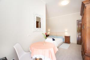 Postel nebo postele na pokoji v ubytování Lu Lioni Rooms
