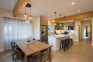 a kitchen and dining room with a wooden table and chairs at 7043 County Road 203 - Durango Valley View in Hermosa