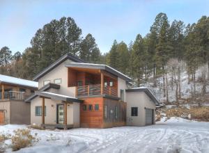 a house in the winter with snow at 7043 County Road 203 - Durango Valley View in Hermosa