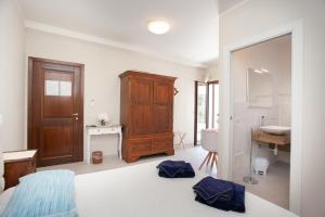 Postel nebo postele na pokoji v ubytování Lu Lioni Rooms