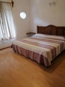 Postel nebo postele na pokoji v ubytování Posada Bugambilias