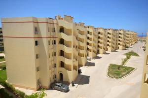 an overhead view of a row of apartment buildings at ALFRDOUS LUXURY VACATION HOME NORTH COAST in Sīdī ‘Abd ar Raḩmān