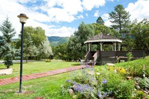 a gazebo with a bench in a park at Pine Acres Unit 112 in Durango