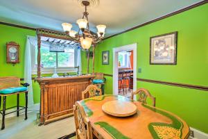 a dining room with green walls and a table and chairs at Lucys Place Elizabethtown Home with Fire Pit in Elizabethtown