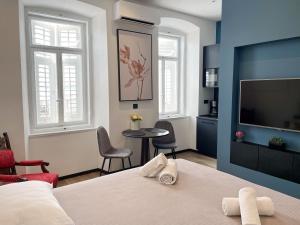 Posteľ alebo postele v izbe v ubytovaní Navis city apartments