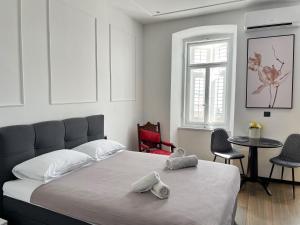Posteľ alebo postele v izbe v ubytovaní Navis city apartments